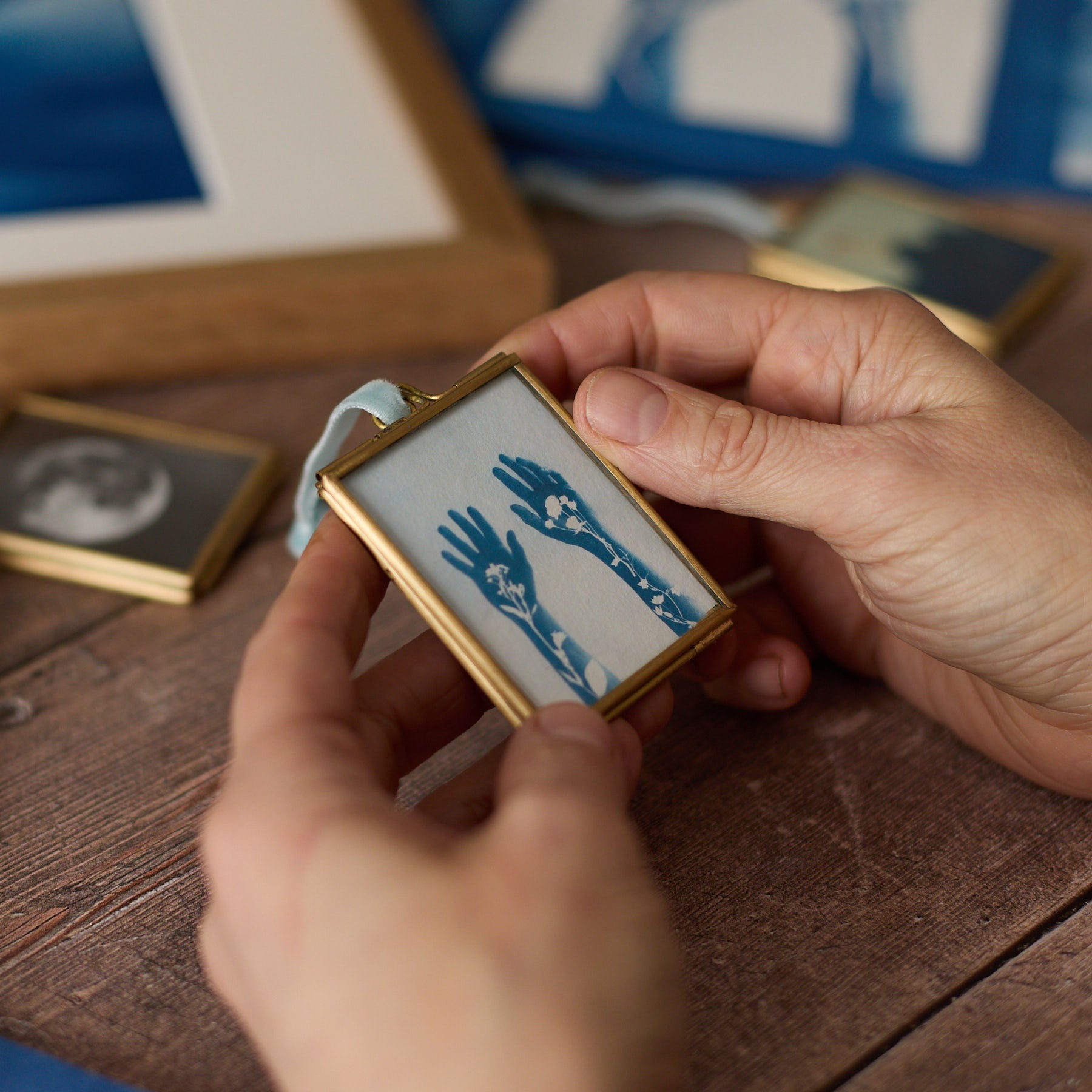 Hands in Flowers - Mini Print in Hanging Brass Frame
